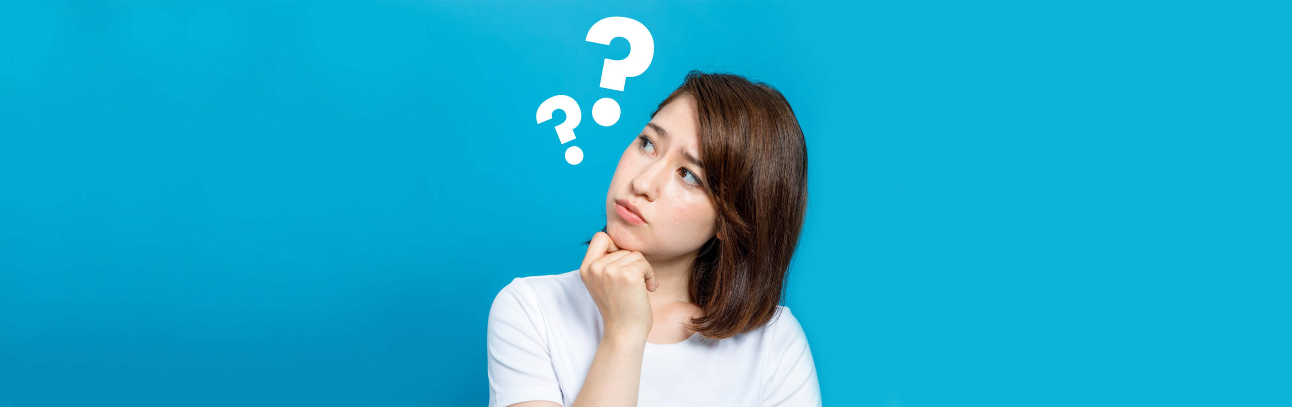 Image of confused woman with question marks